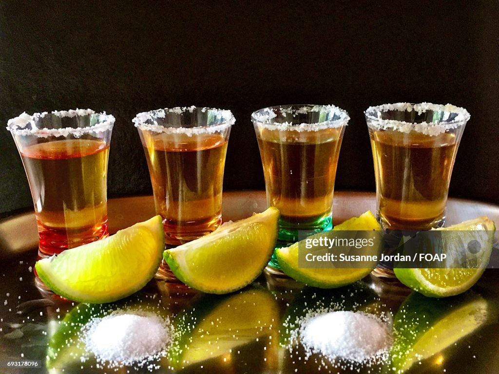 Close-up of tequila shots on table