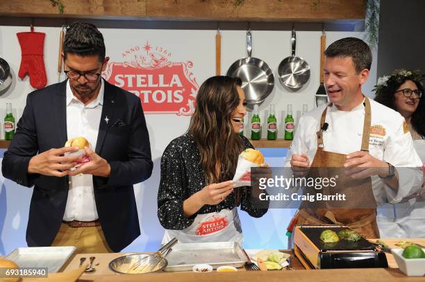 Belgian Chef Bart Vandaele leads a summer grilling demonstration with Shay Mitchell and Harry Lewis, Vice President, Stella Artois, at the Stella...
