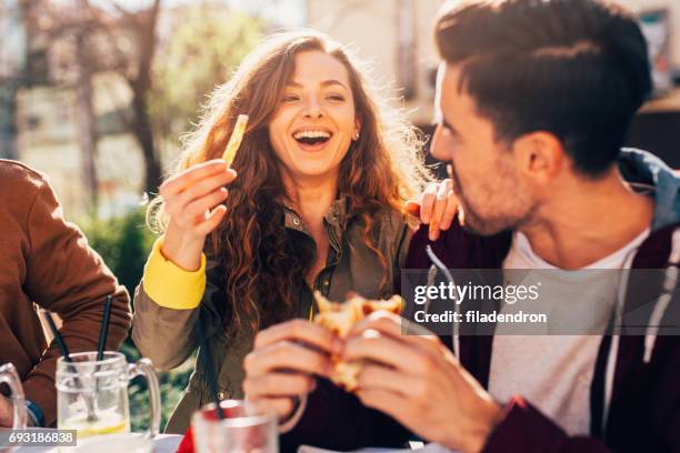 coppia in un ristorante - happy couple eating foto e immagini stock