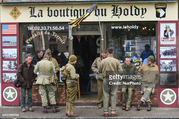 People take a stop in St Marie Du Mont on their way to the International Commemorative Ceremony of the Allied Forces Landing in Normandy in the...