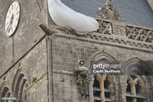 Scene memorasing a well-known incident involved paratrooper John Steele of the 505th Parachute Infantry Regiment, whose parachute caught on the spire...