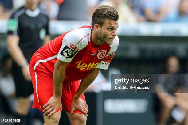 Benedikt Saller of Jahn Regensburg looks on during the Second Bundesliga Playoff second leg match between TSV 1860 Muenchen and Jahn Regensburg at...