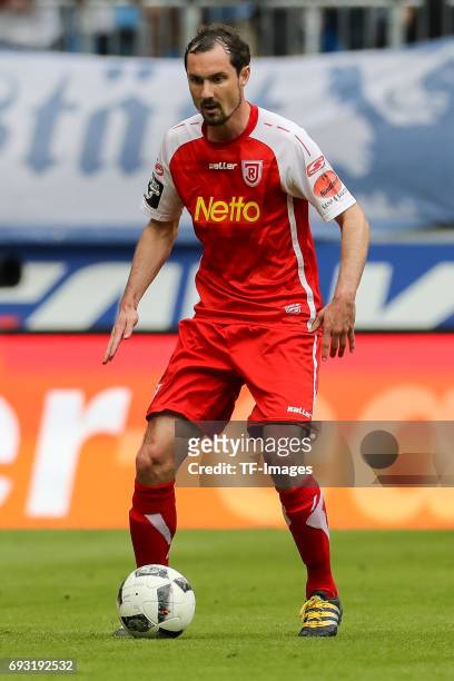 Sebastian Nachreiner of Jahn Regensburg controls the ball during the Second Bundesliga Playoff second leg match between TSV 1860 Muenchen and Jahn...