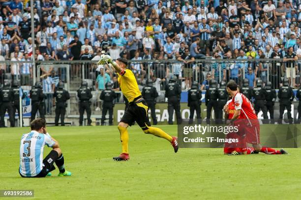 Maximilian Wittek of 1860 Munich looks dejected , Goalkeeper Philipp Pentke of Jahn Regensburg Marvin Knoll of Jahn Regensburg Sebastian Nachreiner...