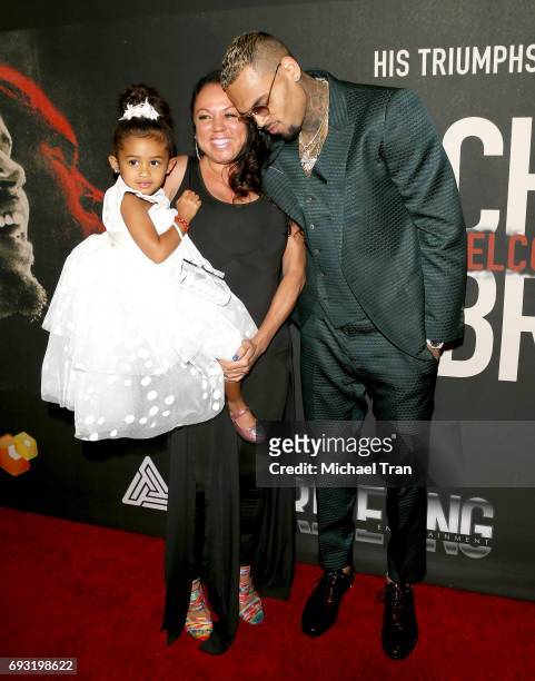 Chris Brown with mom, Joyce Hawkins and his daughter, Royalty Brown attend the Los Angeles premiere of Fathom Events' "Chris Brown: Welcome To My...
