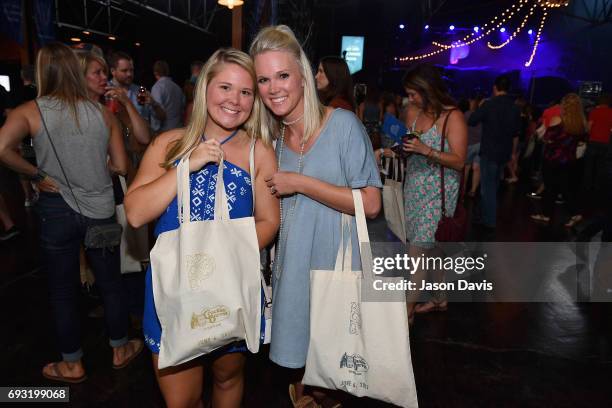 Guests pose with freshly screen printed Cracker Barrel tote bags during Pandora Sounds Like Country at Marathon Music Works on June 6, 2017 in...