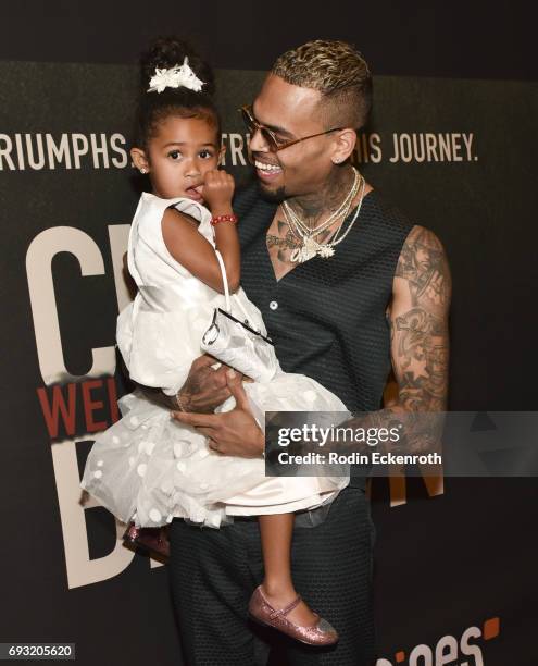 Singer-songwriter Chris Brown and daughter Royalty Brown attend the premiere of "Chris Brown: Welcome to My Life" at Regal LA Live Stadium 14 on June...