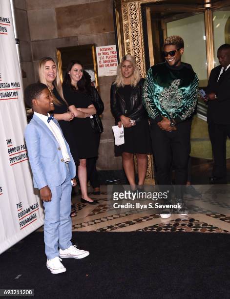 Singer-songwriter Usher Raymond IV and his son Naviyd Ely Raymond attend the 2017 Gordon Parks Foundation Awards Gala at Cipriani 42nd Street on June...