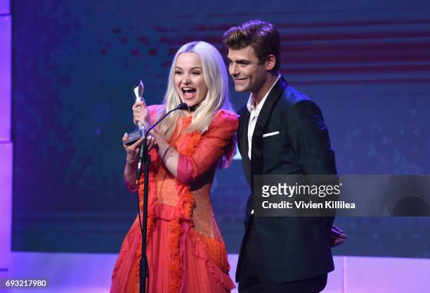 Honorees Dove Cameron and Garrett Clayton accept award onstage during the 42nd Annual Gracie Awards, hosted by The Alliance for Women in Media at the...