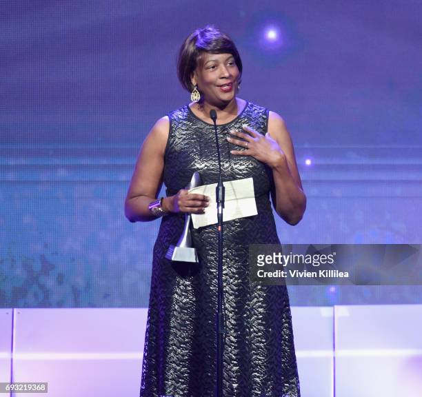 Producer Dawn Porter accepts an award onstage during the 42nd Annual Gracie Awards, hosted by The Alliance for Women in Media at the Beverly Wilshire...