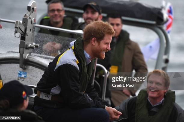 Prince Harry chats with sailors during a sailing demonstration on Sydney Harbour on June 7, 2017 in Sydney, Australia. Prince Harry is on a two-day...