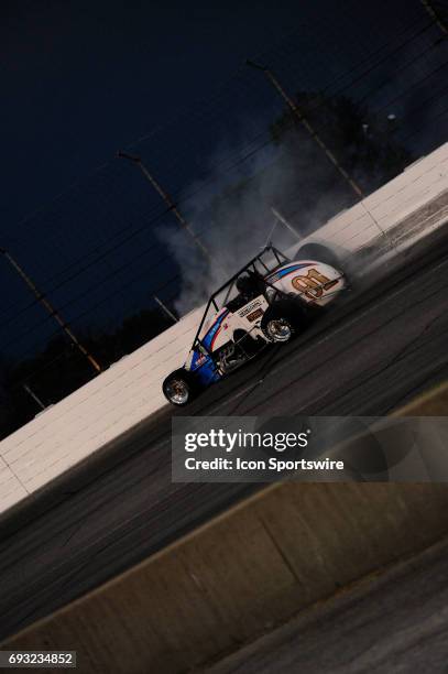 Justin Grant Carli/Hemelgarn Racing slides along the outside turn three wall in the Carb Night Classic United States Auto Club Silver Crown Champ Car...