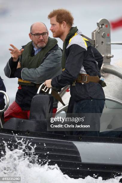 Patron of the Invictus Games Foundation Prince Harry watches an Invictus Games Sydney 2018 Sailing Event in Sydney Harbour on June 7, 2017 in Sydney,...