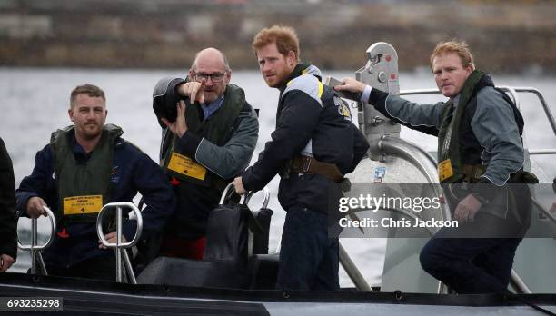 Patron of the Invictus Games Foundation Prince Harry watches an Invictus Games Sydney 2018 Sailing Event in Sydney Harbour on June 7, 2017 in Sydney,...