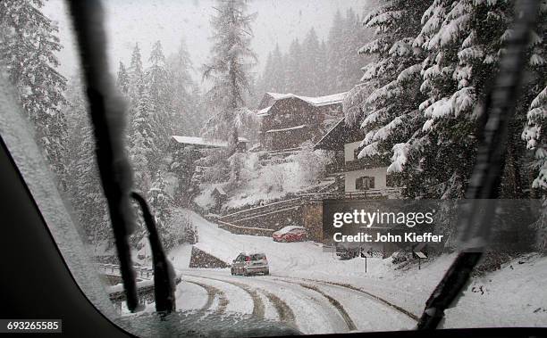 winter driving in snowstorm. - canazei foto e immagini stock