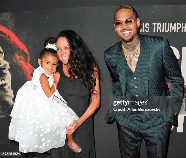 Chris Brown with mom, Joyce Hawkins and his daughter, Royalty Brown attend the premiere of Fathom Events' "Chris Brown: Welcome To My Life" at Regal...