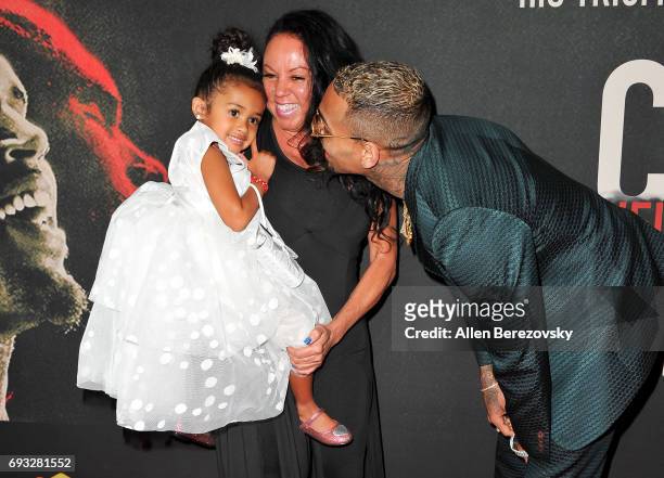 Chris Brown with mom, Joyce Hawkins and his daughter, Royalty Brown attend the premiere of Fathom Events' "Chris Brown: Welcome To My Life" at Regal...