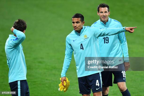 Tim Cahill of Australia gestures to Robbie Kruse of Australia during the Australian Socceroos training session at the Adelaide Oval on June 7, 2017...