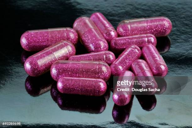 close up of designer club drug pills - anfetaminas fotografías e imágenes de stock