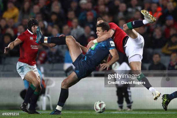 Matt Duffie of the Blues is tackled in the air by Liam Williams of the British & Irish Lions during the 2017 British & Irish Lions tour match between...