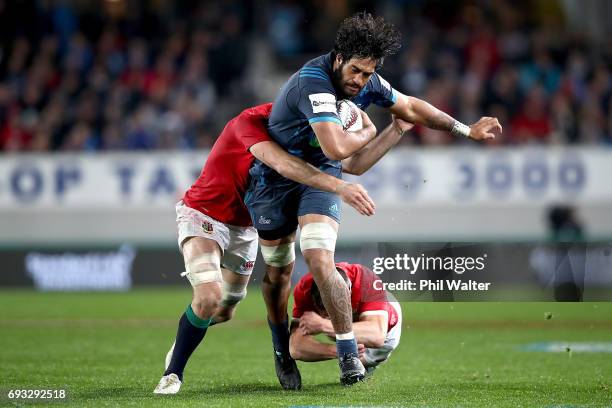 Akira Ioane of the Blues is tackled during the match between the Auckland Blues and the British & Irish Lions at Eden Park on June 7, 2017 in...