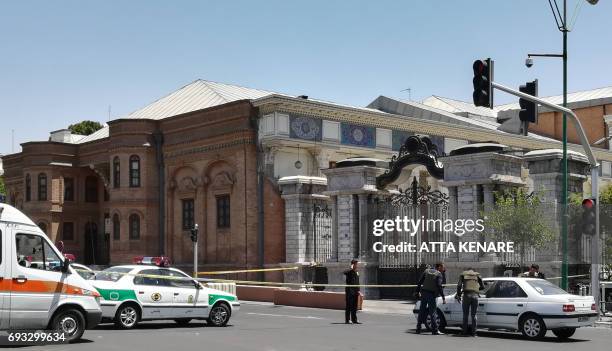 Picture shows the scene outside the Iranian parliament in the capital Tehran on June 7, 2017 during an attack on the complex. Gunmen and suicide...