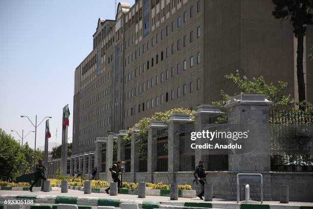 Iranian police officers conduct an operation against the attacker in the parliament building after gunmen opened fire at Irans parliament and the...