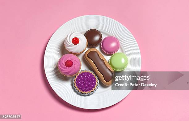 sugar rush,toy food on plate - comfort food stock pictures, royalty-free photos & images