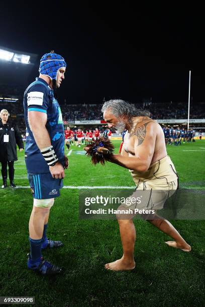 James Parsons of the Blues receives a Taiaha from a Maori Chief after winning the match between the Auckland Blues and the British & Irish Lions at...