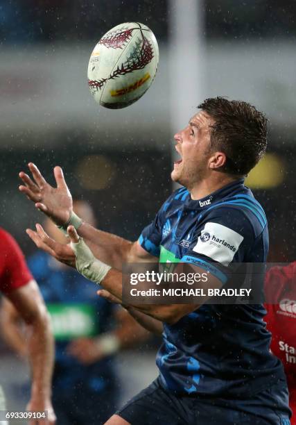 Blues' Michael Collins catches the high ball during the rugby union match between The British and Irish Lions and Auckland Blues at Eden Park in...