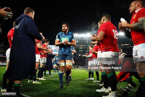 Steven Luatua of the Blues is congratulated by the Lions team after winning the match between the Auckland Blues and the British & Irish Lions at...