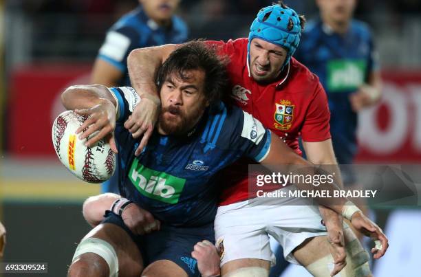 British and Irish Lions' Justin Tipuric tackles Blues' Steven Luatua during the rugby union match between The British and Irish Lions and Auckland...