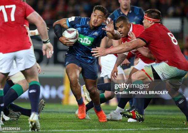 Blues' Augustine Pulu makes a break during the rugby union match between The British and Irish Lions and Auckland Blues at Eden Park in Auckland on...