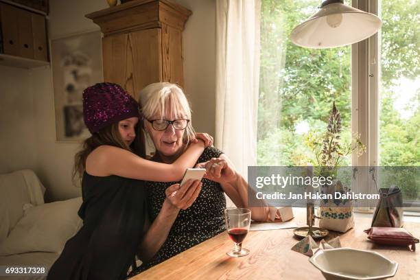 grandmother and child in cottage - grandmother bildbanksfoton och bilder
