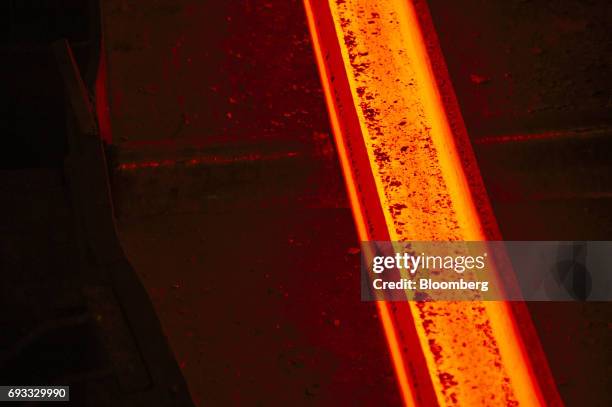 Red hot steel beam lies ready to be processed inside the ArcelorMittal HighVeld Steel & Vanadium Corp. Plant in eMalahleni, South Africa, on Tuesday,...