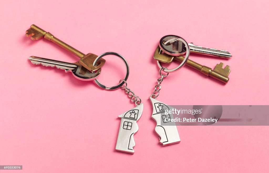 Divorce house keys on pink