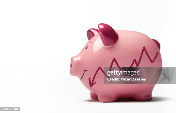 piggy bank with graph going down, black monday - saving for a rainy day englische redewendung stock-fotos und bilder