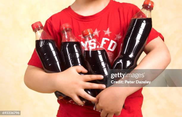 five year old boy with cola close up - cola bottle foto e immagini stock