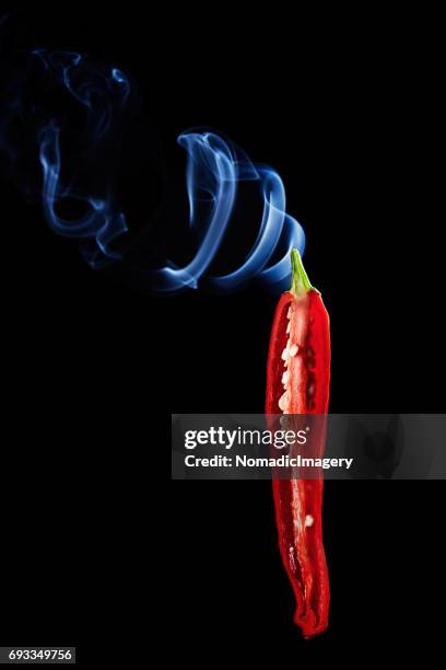 chili pepper smoking hot and spicy - red pepper stock pictures, royalty-free photos & images