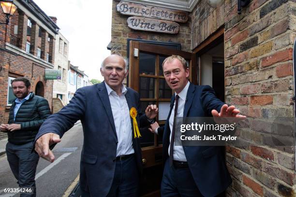 Liberal Democrat Leader Tim Farron and former Secretary of State for Business, Innovation and Skills Vince Cable leave a wine bar as they campaign in...