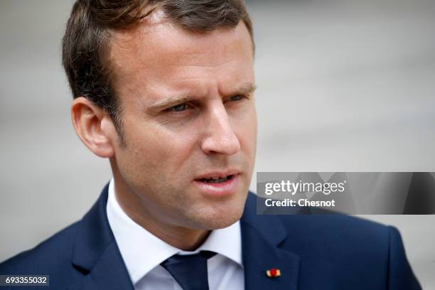 French President Emmanuel Macron makes a statement next to Danish Prime Minister Lars Lokke Rasmussen prior to their meeting at the Elysee...