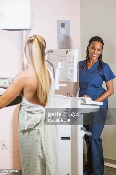 woman getting mammogram - mammogram diversity stock pictures, royalty-free photos & images