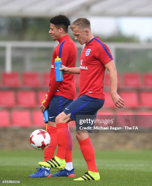 James Ward-Prowse juggles a ball of England U21 looks on during the England U21 training session at St Georges Park on June 7, 2017 in...