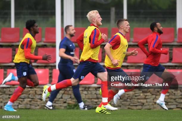 Will Hughes of England U21 and teammates warm up during the England U21 training session at St Georges Park on June 7, 2017 in Burton-upon-Trent,...