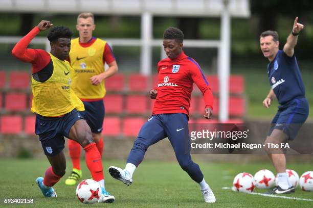 Kortney Hause and Demarai Gray of England U21 compete for the ball during the England U21 training session at St Georges Park on June 7, 2017 in...