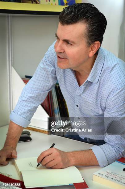 The baritone, pianist and popularizer Ramon Gener signs a boos during the Book Fair 2017 at El Retiro Park on June 3, 2017 in Madrid, Spain.