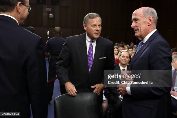 Senate Intelligence Committee Chairman Richard Burr visits with Director of National Intelligence Daniel Coats as they prepare for a hearing in the...
