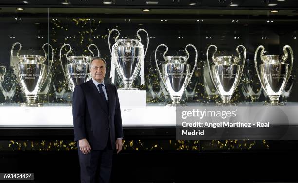 President Florentino Perez of Real Madrid places the 12th UEFA Champions League trophy in Real Madrid museum at Estadio Santiago Bernabeu on June 7,...