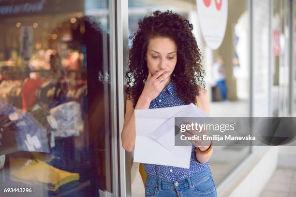 portrait of a young woman getting the mail - reading letter stock pictures, royalty-free photos & images