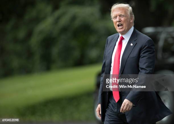 President Donald Trump shouts to reporters while departing the White House June 7, 2017 in Washington, DC. Trump was scheduled to travel to...